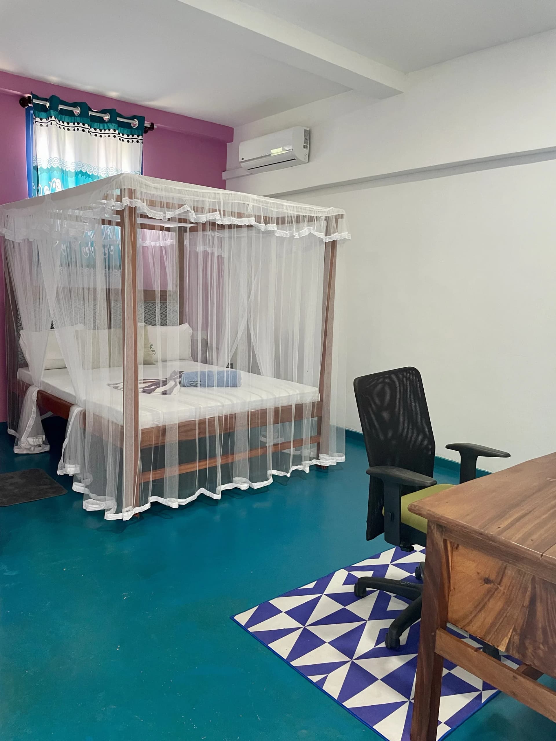 Spacious bedroom suite in Apartment 1 with air conditioning
