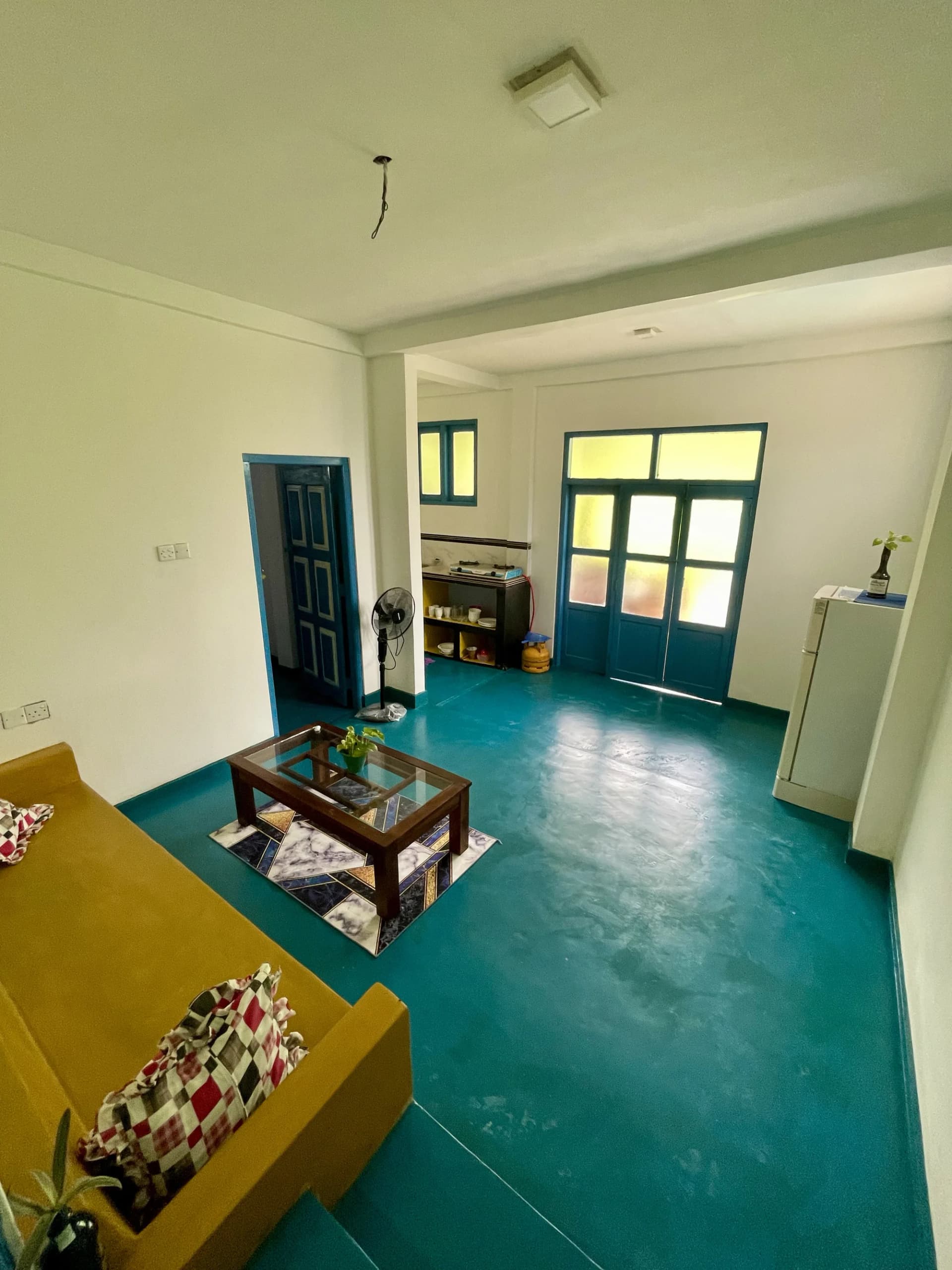 Apartment 1 polished colored cement floor and clothing rack